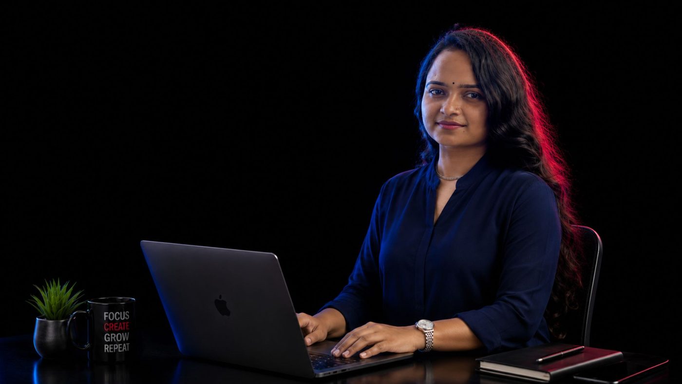 Lima Mondal editing videos on her laptop